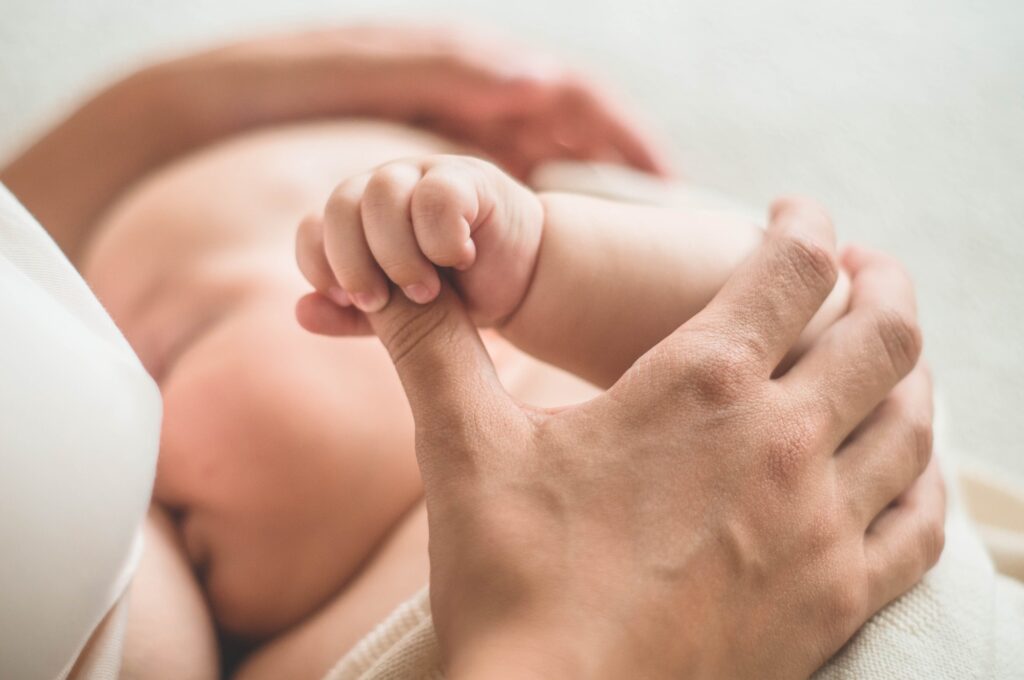 Portrait of a mom and breast feeding baby