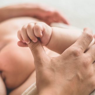 Portrait of a mom and breast feeding baby